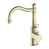 Nero York Basin Mixer Hook Spout With White Porcelain Lever - Aged Brass